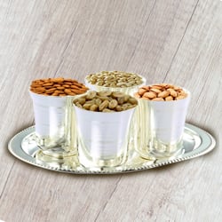 Crunchy mixed Dry Fruits with Silver Glasses and Tray