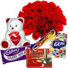 Small Teddy, Assorted Cadburys Chocolate and 12 Red Roses Bouquet