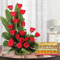 Magical Love Bouquet of 18 Red Roses with 1/2 Kg. Assorted Sweets