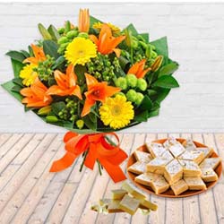 Sweetest Basket of Kaju Barfi with Bouquet of Vibrant Seasonal Flowers