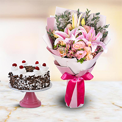 Mixed fresh Seasonal Flowers with festive Black Forest Cake