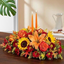 Delightful arrangement of gorgeous Flowers with 2 lovely Candles
