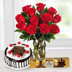 Gorgeous Bouquet of bright Red Roses, tasty Ferroro Rocher and delicious Black Forest Cake