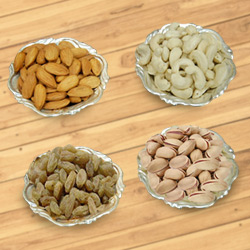 Delectable mixed Dry Fruits with Silver plated bowls