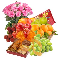Nutritious Fresh Fruits Grandeur with Haldiram Soan papdi and Rose Bouquet