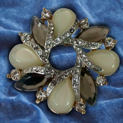 Poignant Opal Rhinestone Brooch Cum Pendant from the Collection of Avon