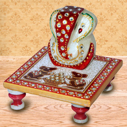 Delicately carved marbel designer ganesh with chowki
