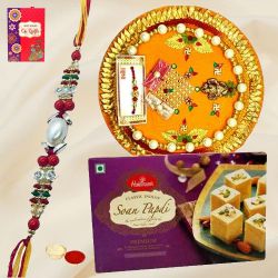 Delicious Pack of Rakhi Special Soan Papri from Haldiram and Thali along with Rakhi, Roli Tilak and Chawal