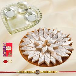 Irresistible Kaju Katli from Haldiram and Fancy Silver Plated Paan Shaped Puja Aarti Thali with Rakhi, Roli Tilak and Chawal for your Loving Brother