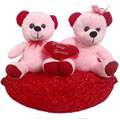 Excellent Two Teddy Bears Sitting on Red Cushion