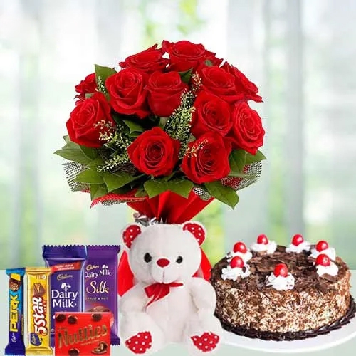 12 Exclusive  Dutch Red  Roses  Bouquet with Cake  Cadburys Assorted Chocolates and  a Cute Teddy Bear