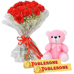 Cute Combo of Small Teddy with Red Carnation Bouquet N Toblerone Chocolate