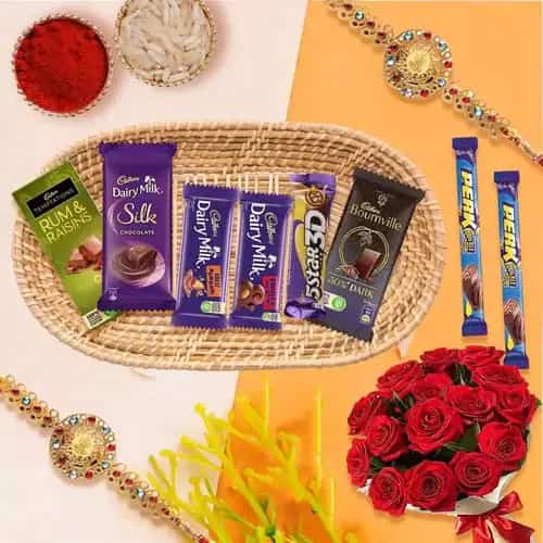 Gift Hamper of Cadbury Chocolates with Red Roses with 2 Rakhi Roli Tilak and Chawal