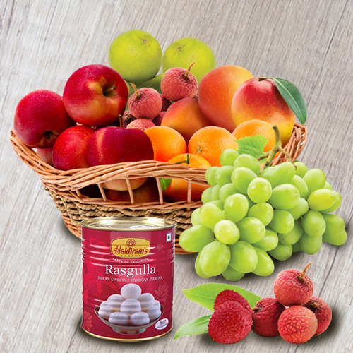 Sumptuous Fresh Fruits Basket with Haldirams Rasgulla