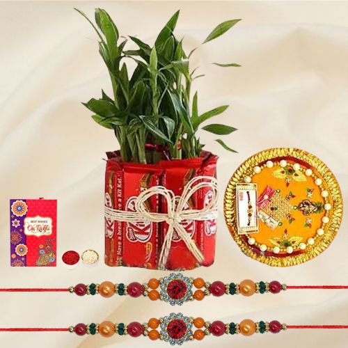 Enticing Stone Rakhi with Bamboo Plant n Kitkat Arrangement n Thali